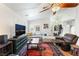 Comfortable living room featuring a fireplace and cozy seating arrangement at 4329 Skimmers Ct, North Las Vegas, NV 89084