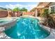 Lush backyard featuring a private pool and covered patio at 4329 Skimmers Ct, North Las Vegas, NV 89084