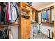 Walk-in closet featuring custom wood shelving and storage options at 4329 Skimmers Ct, North Las Vegas, NV 89084