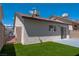 Low-maintenance backyard featuring artificial grass and privacy fencing at 4481 Faberge Ave, Las Vegas, NV 89115
