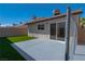 Backyard view showcases low-maintenance artificial grass and secure fencing at 4481 Faberge Ave, Las Vegas, NV 89115