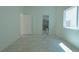 This bedroom has tile floors with a bathroom attached at 4481 Faberge Ave, Las Vegas, NV 89115