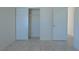 Bedroom with tile floors, closet and white doors to match at 4481 Faberge Ave, Las Vegas, NV 89115