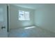 This bedroom has tile floors and a window at 4481 Faberge Ave, Las Vegas, NV 89115