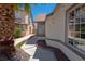 View of side yard featuring decorative rock and walkway to back yard at 4481 Faberge Ave, Las Vegas, NV 89115