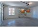 Well-lit garage featuring ample storage cabinets and a view from a window at 4481 Faberge Ave, Las Vegas, NV 89115