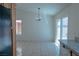 Open kitchen featuring tile floors, granite countertops and direct access to the back yard at 4481 Faberge Ave, Las Vegas, NV 89115