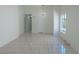 Open floor plan featuring tile flooring, neutral walls, large window, and bright open space at 4481 Faberge Ave, Las Vegas, NV 89115