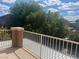 A serene view from the balcony captures the surrounding greenery and bright blue sky at 4951 Ivylyn Ct, Las Vegas, NV 89122