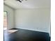 An empty bedroom with hardwood floors and a sliding door leading to the outside at 4951 Ivylyn Ct, Las Vegas, NV 89122