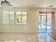 Open dining area with tile floors, abundant natural light from windows, and easy access to outdoor patio at 4951 Ivylyn Ct, Las Vegas, NV 89122