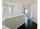 Upstairs hallway featuring hardwood floors and natural light from nearby windows at 4951 Ivylyn Ct, Las Vegas, NV 89122