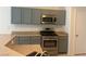 Well-equipped kitchen features stainless steel appliances, stylish cabinets, and stone countertops at 4951 Ivylyn Ct, Las Vegas, NV 89122