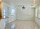 Open living space with tile flooring, modern lighting, and connectivity to the kitchen, perfect for entertaining at 4951 Ivylyn Ct, Las Vegas, NV 89122