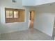 Bright living room boasts tile flooring and neutral walls, creating a welcoming atmosphere for relaxation at 4951 Ivylyn Ct, Las Vegas, NV 89122