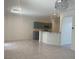 Expansive living area with tile floors, modern lighting, and views into the kitchen for seamless entertaining at 4951 Ivylyn Ct, Las Vegas, NV 89122