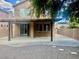 A spacious patio area with concrete flooring and awning, perfect for outdoor entertaining at 4951 Ivylyn Ct, Las Vegas, NV 89122