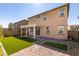 Backyard features artificial turf and pavers, plus a pergola creating an outdoor living space at 528 Sunny Pointe St, Henderson, NV 89011