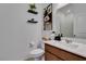 A view of the bathroom featuring a plant and decorative shelves at 528 Sunny Pointe St, Henderson, NV 89011