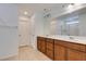 Bathroom features double sink vanity with updated fixtures, tile floors, and separate toilet closet at 528 Sunny Pointe St, Henderson, NV 89011