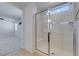 Bright bathroom featuring a glass shower with a built in seat and tile flooring at 528 Sunny Pointe St, Henderson, NV 89011