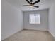 Bedroom featuring carpet flooring, and a ceiling fan with a window at 528 Sunny Pointe St, Henderson, NV 89011