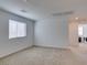 A view of the bedroom featuring a window and access to the laundry room at 528 Sunny Pointe St, Henderson, NV 89011