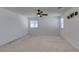 Light and airy bedroom with carpet, neutral paint, ceiling fan, wall decor, and ample natural light at 528 Sunny Pointe St, Henderson, NV 89011