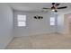 Large bedroom with neutral carpet, neutral paint, updated ceiling fan, and great natural light at 528 Sunny Pointe St, Henderson, NV 89011