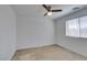 Bedroom featuring a ceiling fan, a window, and neutral carpet at 528 Sunny Pointe St, Henderson, NV 89011