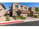 Charming two-story home featuring stone accents, a two-car garage, and professionally landscaped front yard at 528 Sunny Pointe St, Henderson, NV 89011