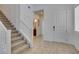Inviting foyer with tile floors and staircase, showcasing a bright and open entrance to the home at 528 Sunny Pointe St, Henderson, NV 89011