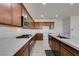 The modern kitchen showcases a stainless cooktop, microwave, and expansive counter space, perfect for cooking at 528 Sunny Pointe St, Henderson, NV 89011