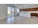 Open kitchen with stainless appliances, a breakfast bar, and direct access to the backyard through a sliding glass door at 528 Sunny Pointe St, Henderson, NV 89011