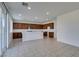 The open kitchen is equipped with stainless steel appliances, wood cabinets, and a large island at 528 Sunny Pointe St, Henderson, NV 89011