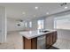 Open-concept kitchen with island seating, stainless steel dishwasher, and bright, airy feel, ideal for entertaining at 528 Sunny Pointe St, Henderson, NV 89011