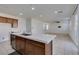 Bright kitchen featuring island seating, stainless dishwasher, and open-concept design, great for gatherings at 528 Sunny Pointe St, Henderson, NV 89011