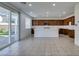 A bright kitchen features ample counter space, stainless steel appliances, and backyard access at 528 Sunny Pointe St, Henderson, NV 89011