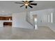 Open-concept living space with tile flooring and staircase, creating a seamless flow throughout the home at 528 Sunny Pointe St, Henderson, NV 89011