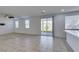 Inviting living room with natural light, fan, and sliding glass doors to the patio at 528 Sunny Pointe St, Henderson, NV 89011