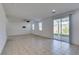 Spacious living room with a ceiling fan, and a sliding glass door that offers access to the backyard at 528 Sunny Pointe St, Henderson, NV 89011