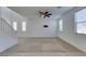 Bright living room with carpet, neutral paint, updated ceiling fan, and plenty of windows at 528 Sunny Pointe St, Henderson, NV 89011