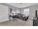 Comfortable bedroom with a desk and a view from the large window at 5433 Escallonia St, Las Vegas, NV 89149