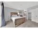 Inviting bedroom featuring an ensuite bathroom, closet, neutral walls, and great natural light at 5433 Escallonia St, Las Vegas, NV 89149
