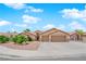 Charming single-story home featuring a two-car garage, desert landscaping, and a well-maintained facade at 5433 Escallonia St, Las Vegas, NV 89149