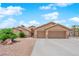 Beautiful single-story home featuring desert landscaping, a two-car garage, and an elegant covered entryway at 5433 Escallonia St, Las Vegas, NV 89149