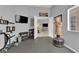 Home gym featuring rubber flooring and well-equipped with weightlifting equipment and heavy bag at 5433 Escallonia St, Las Vegas, NV 89149