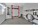 Home gym featuring rubber flooring and well-equipped with weightlifting equipment at 5433 Escallonia St, Las Vegas, NV 89149