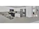 Bright kitchen with stainless steel appliances, stone countertops, white cabinets, and breakfast bar at 5433 Escallonia St, Las Vegas, NV 89149