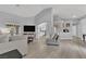Bright living room features wood-look flooring, neutral paint, and a seamless flow at 5433 Escallonia St, Las Vegas, NV 89149